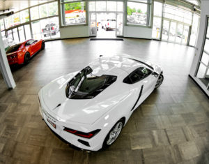 Aerial view of White 2020 C8 Corvette focusing on rear of vehicle